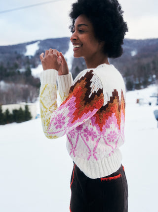 woman wearing Lingua Franca NYC sweater in the snow