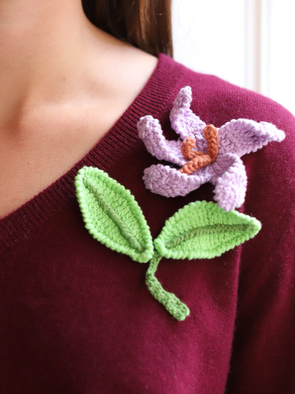 maroon v-neck, purple crochet flower